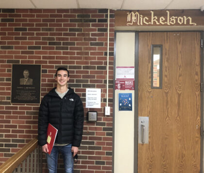 Max Mickelson in front of Mickelson Hall, part of USD's North Complex