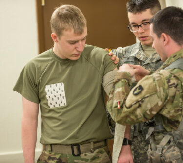 ROTC cadets practice tourniquets
