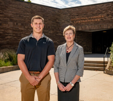 Alex Bergeson and Paula Mabee stand outside of Churchill-Haines Laboratories.
