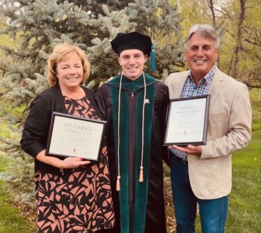 Tiegen Lindner and his parents at his graduation from the PT program.